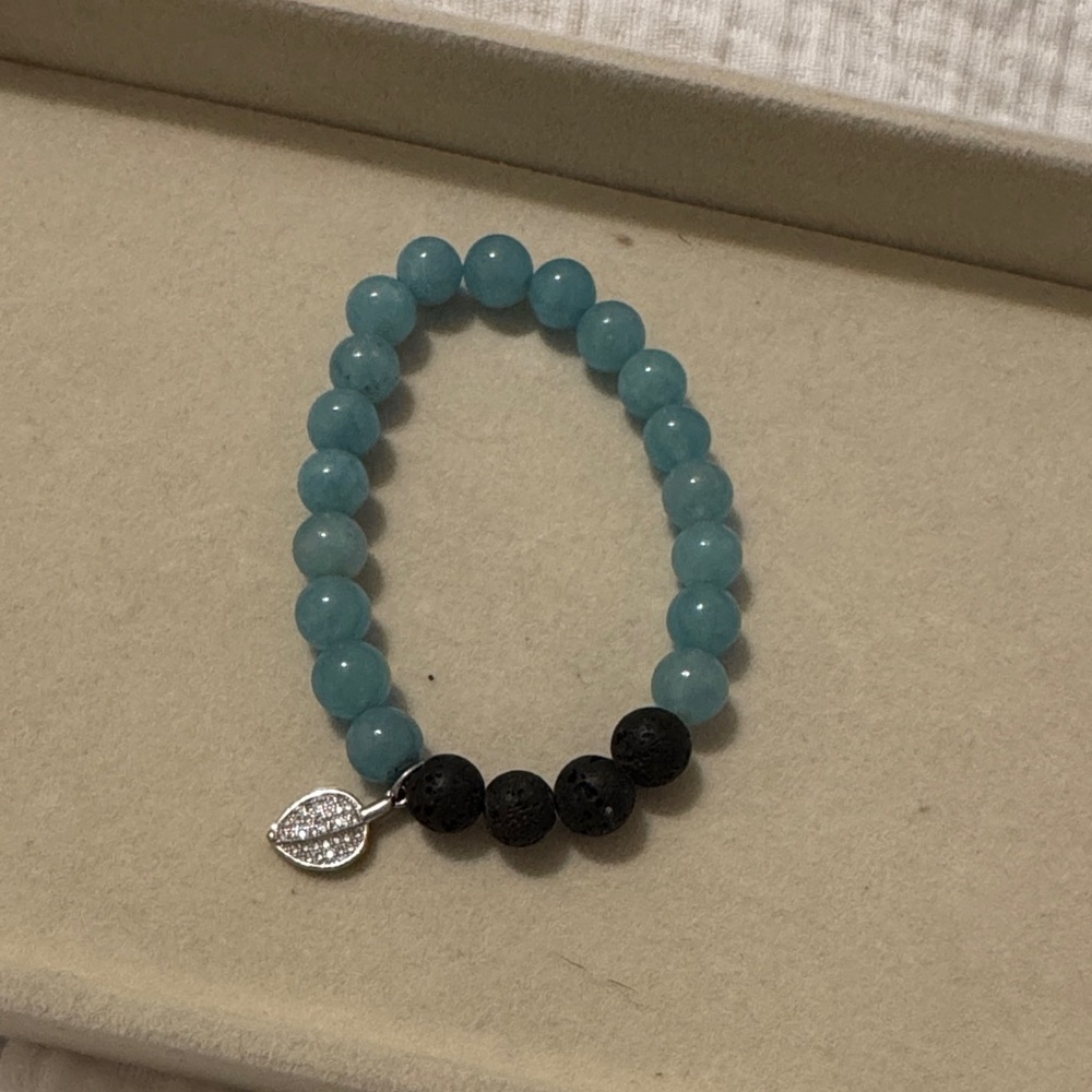 Aqua Beaded Stretch Bracelet with Black Lava Accents and Leaf Charm